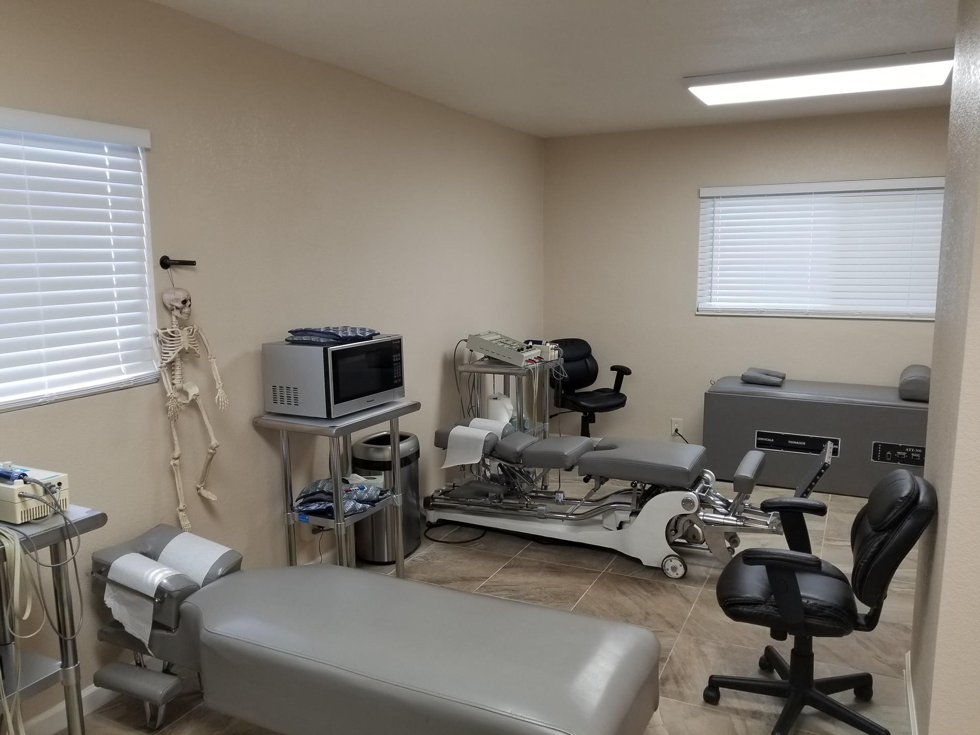 Chiropractic treatment room with flexion-distraction table